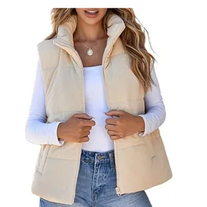 Close-up of beige corduroy puffer vest featuring quilted texture and zipper