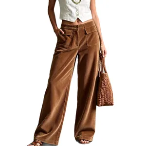 Women's vintage brown corduroy wide-leg trousers with high waist and pockets.