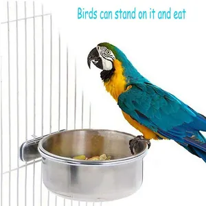 Detailed view of a stainless steel bird feeder bowl securely attached to a wire bird cage