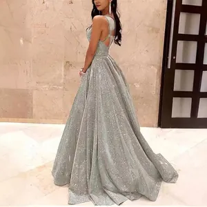 Sparkling silver A-line evening gown with backless design and sequin details.