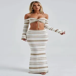 Close-up detail of a women's striped crochet halter top and matching maxi skirt