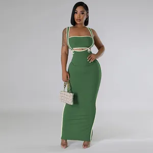 Two-piece green ribbed knit maxi dress set featuring a crop top and bodycon skirt.