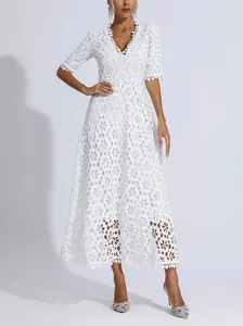 Full view of white deep V-neck floral lace dress with half-sleeves and hollowed details