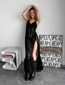 Sexy black sheer lace maxi dress with V-neck and slit detail on model