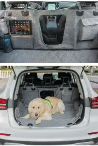 Durable waterproof grey car pet mat with storage pockets and dog lying in SUV trunk