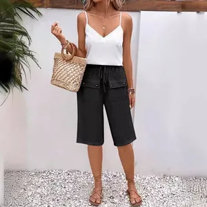 Casual black loose women's shorts featuring large front pockets and drawstring waist