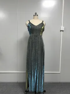 Elegant shiny floor-length evening gown with spaghetti straps and blue-gold gradient glitter