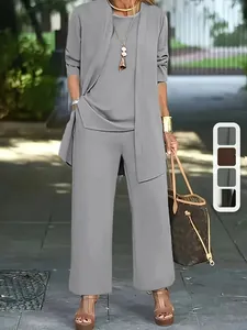 Detail view of a grey three-piece women's outfit including cardigan, vest, and trousers.