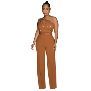 Full-length view of a brown one-shoulder jumpsuit with gold stud details and belt