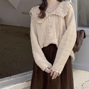 Close-up detail of sweet Korean style knit cardigan featuring a delicate lace doll collar