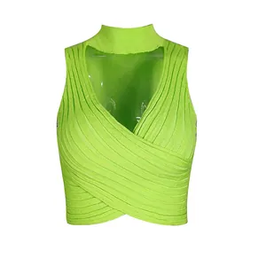 Detail view of neon green rib-knit crop top with criss-cross wrap and high neck