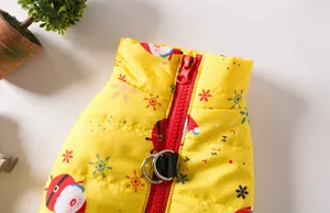 Detail of yellow Christmas dog vest showing red zipper and leash D-ring close-up