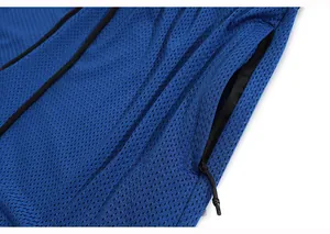 Detailed macro view of blue breathable mesh fabric and pocket on men's sports shorts