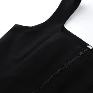 Close-up detail of a minimalist black square neck sleeveless top with side zipper