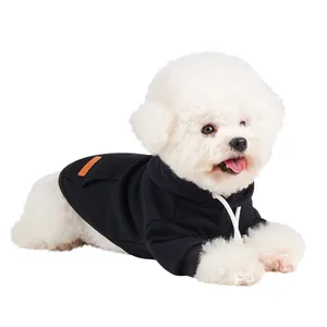 Close-up detail of a white dog wearing a cozy black hooded fleece pet sweatshirt for winter