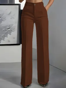Detailed view of women's brown high-waisted straight suit trousers with elegant drape