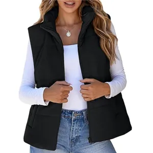 Close-up of black corduroy puffer vest with zipper and stand collar for women