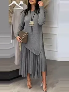 Elegant grey knitted two-piece set with asymmetric top and pleated maxi skirt for women