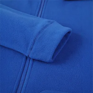 Close-up of blue fleece hoodie detailing the soft texture and durable zipper.