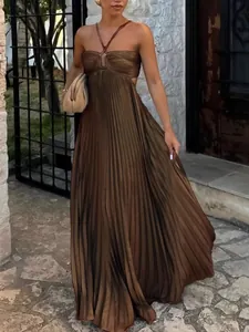 Elegant brown pleated maxi dress with strapless halter neck and flowing skirt for women