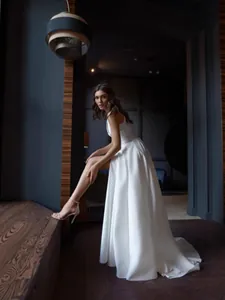Elegant vintage French white evening gown with deep V-neck and high slit for formal events