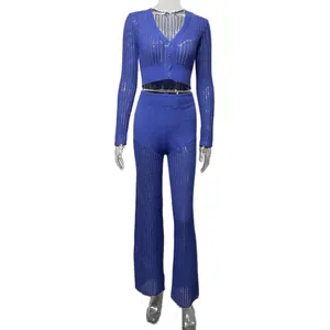 Detail view of royal blue sheer knit set with cropped cardigan and high-waisted pants