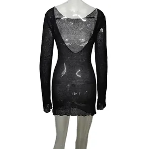 Detail of sexy black knit beach cover-up dress featuring a deep V back design.