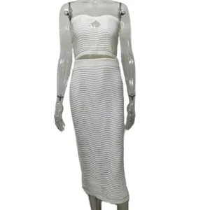 Detailed view of white knitted two-piece set featuring tube top and bodycon midi skirt