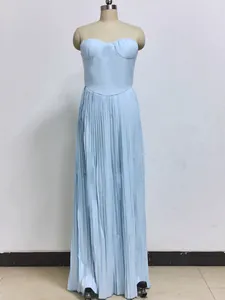 Detail view of a light blue strapless pleated maxi dress on a mannequin