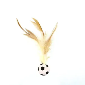 Detail view of cat toy featuring a soccer ball base with long natural feathers.