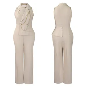 Elegant beige sleeveless jumpsuit with blazer collar, chic gold chain and wide legs
