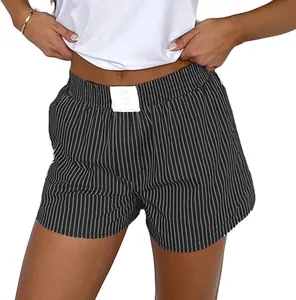 Detailed view of women's striped pajama shorts featuring an elastic waistband and white label
