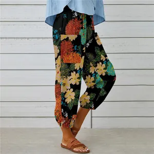 Detail shot of women's boho floral cotton linen cropped pants with elastic waist.