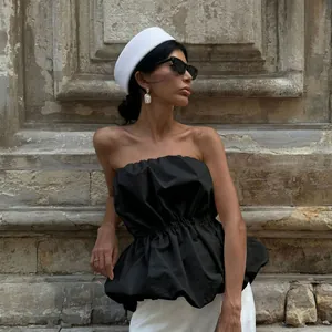 High-fashion black strapless tube top with ruffled waist for a chic summer look