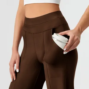 Close-up of brown high-waisted yoga pants featuring a large functional side pocket