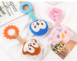 Three colorful cartoon plush dog toys with textured TPR teether rings on white fabric