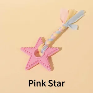 Close-up of a pink star-shaped TPR dog toy with a colorful braided rope detail.