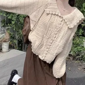 Detail of cream crochet knit cardigan with ruffled doll collar in sweet Korean style
