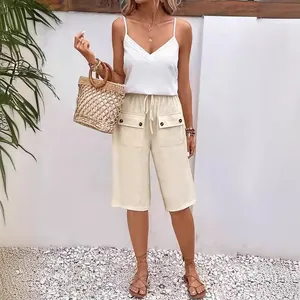 Women's casual beige drawstring shorts featuring front utility pockets and decorative buttons