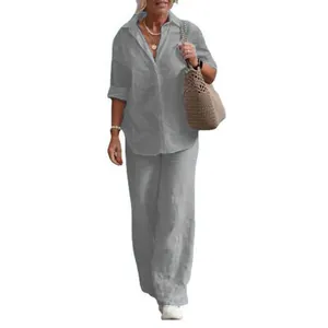 Casual women's two-piece set featuring gray long-sleeve linen shirt and wide-leg pants.