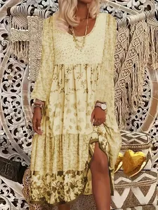 Bohemian style long sleeve floral print maxi dress featuring a tiered skirt design