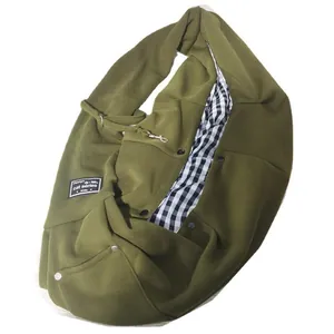 Olive green pet sling bag with black and white checkered lining and safety hook.