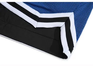 Close-up of blue mesh sports shorts featuring black lining and striped hem detail