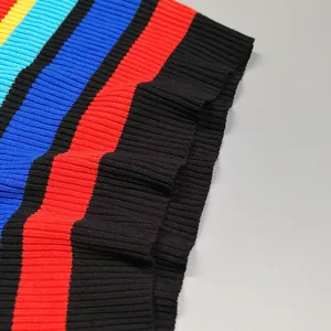 Macro view showing the vibrant multicolor striped pattern and ribbed knit texture