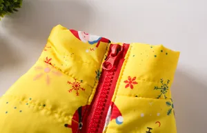 Detailed close-up of red zipper and collar on yellow Christmas dog padded vest jacket