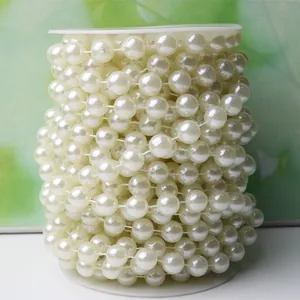 Close-up detail showing the smooth texture and luster of 10mm ABS faux pearl bead strands.