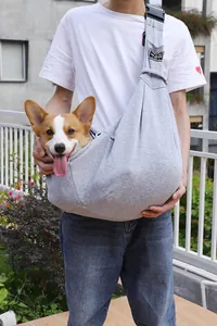 Detail of gray pet sling carrier with adjustable buckle showing a dog inside