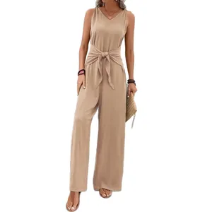 Elegant beige V-neck sleeveless jumpsuit featuring a stylish waist tie and wide-leg trousers