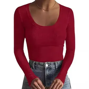 Close-up of red women's ribbed long sleeve T-shirt with slim fit and scoop neck design