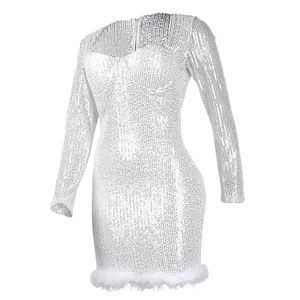 Detailed close-up of white sequin bodycon dress with faux feather hem and long sleeves